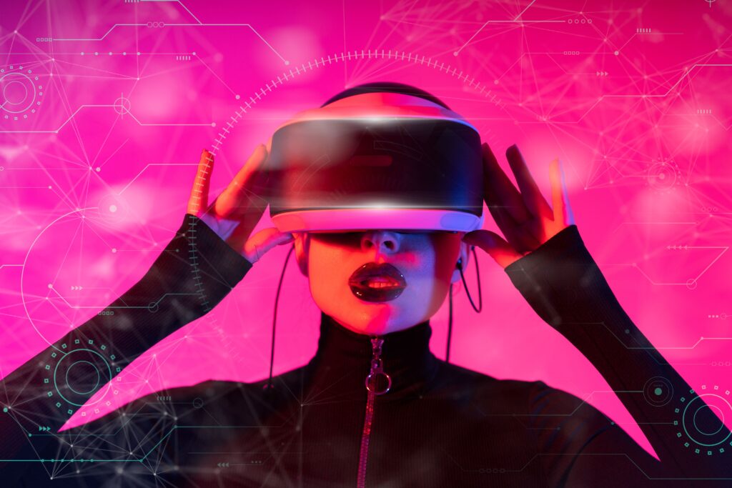 collection-02 A stylish woman interacts with futuristic VR technology in a vibrant setting.